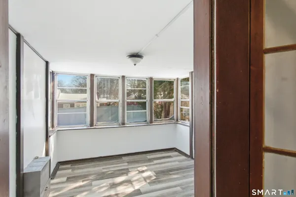 a view of an empty room with a window