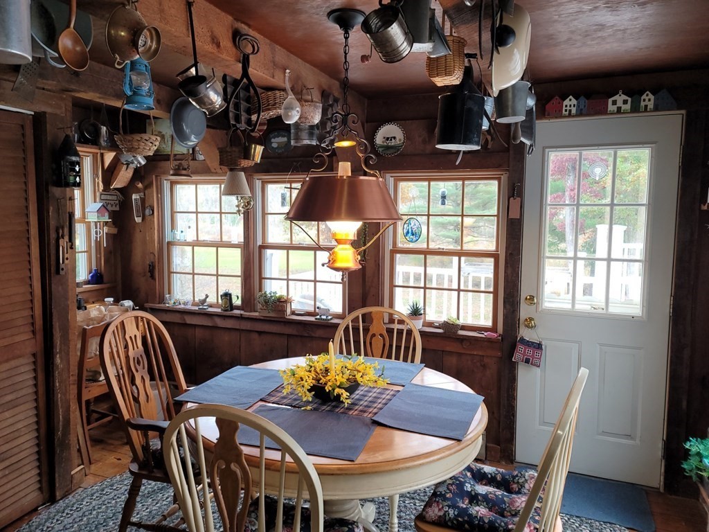 73 Hollow Road Brimfield, MA 01010 - Photo 12 of 23 a view of a dining room with furniture window and wooden floor