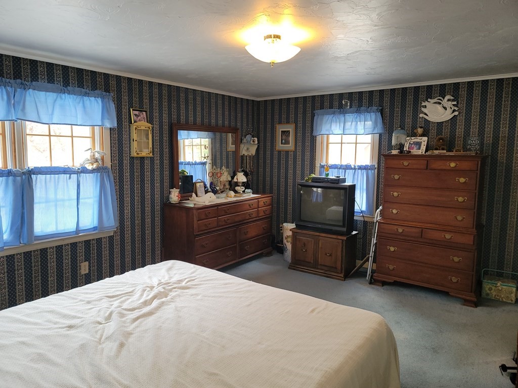 73 Hollow Road Brimfield, MA 01010 - Photo 19 of 23 a bedroom with a bed and a dresser