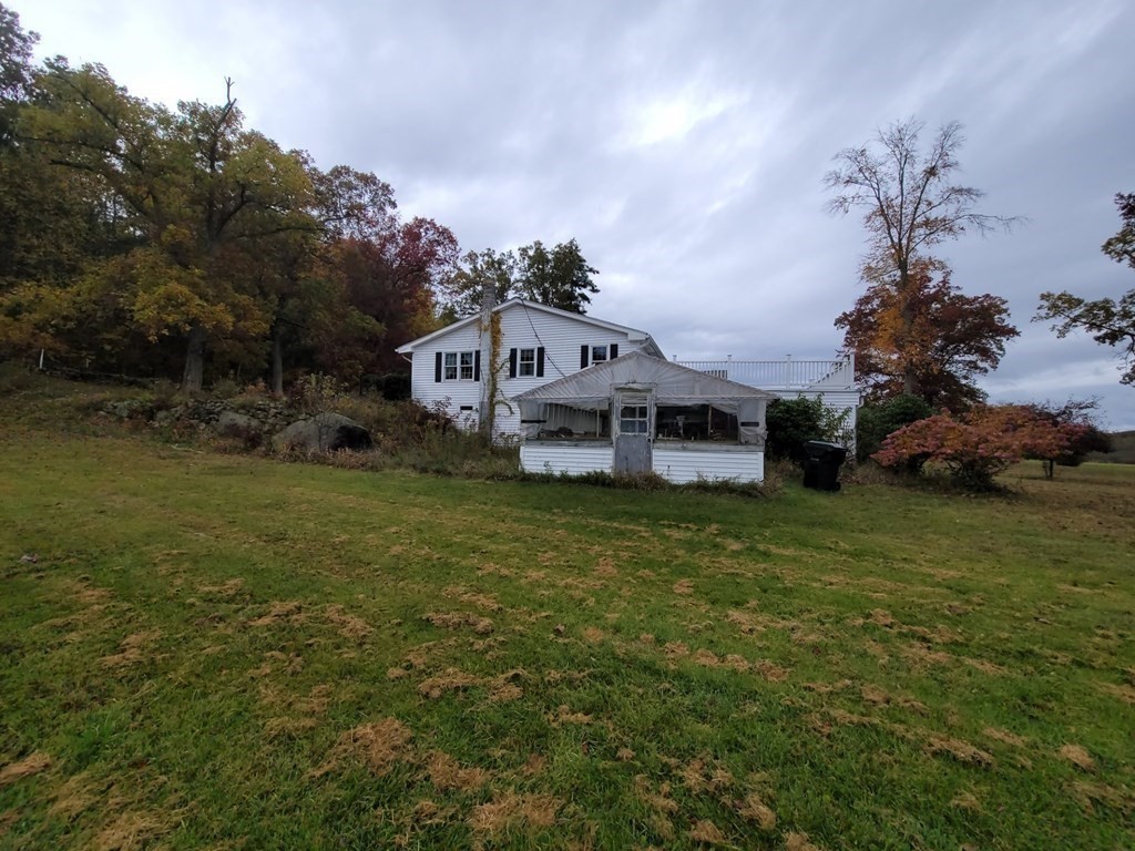 73 Hollow Road Brimfield, MA 01010 - Photo 5 of 23 a front view of a house with a garden