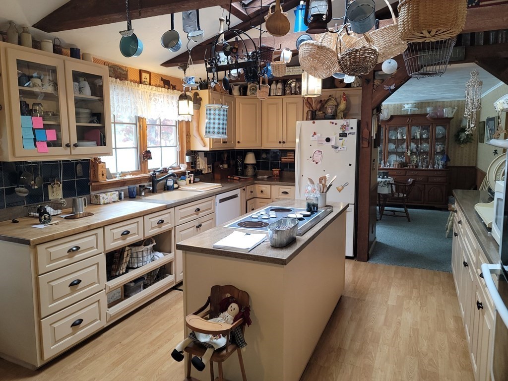 73 Hollow Road Brimfield, MA 01010 - Photo 9 of 23 a kitchen with a stove a sink and a refrigerator