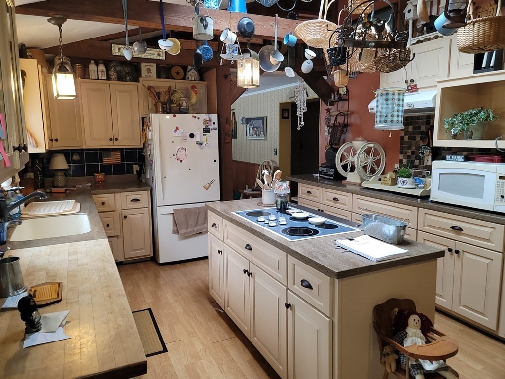 73 Hollow Road Brimfield, MA 01010 - Photo 10 of 23 a kitchen with a sink stove and cabinets