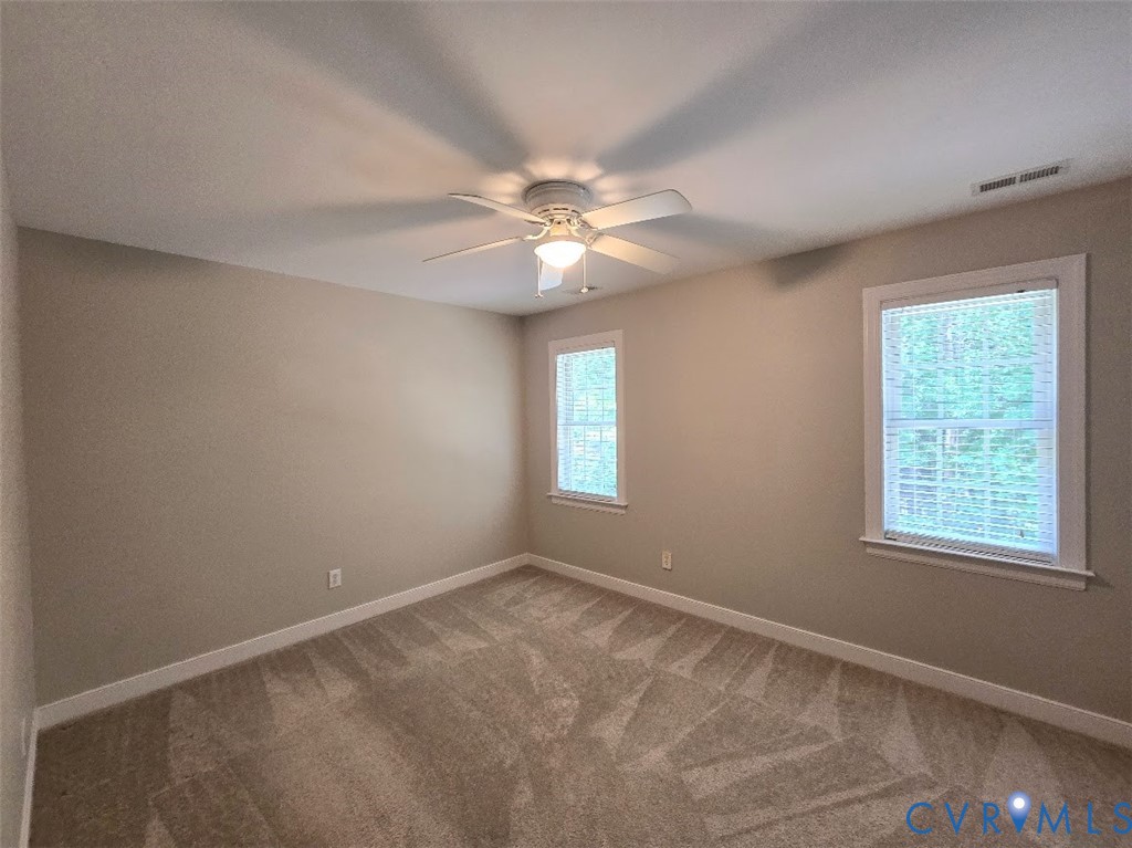 16406 Benmore Road Moseley, VA 23120 - Photo 23 of 32 an empty room with windows and fan