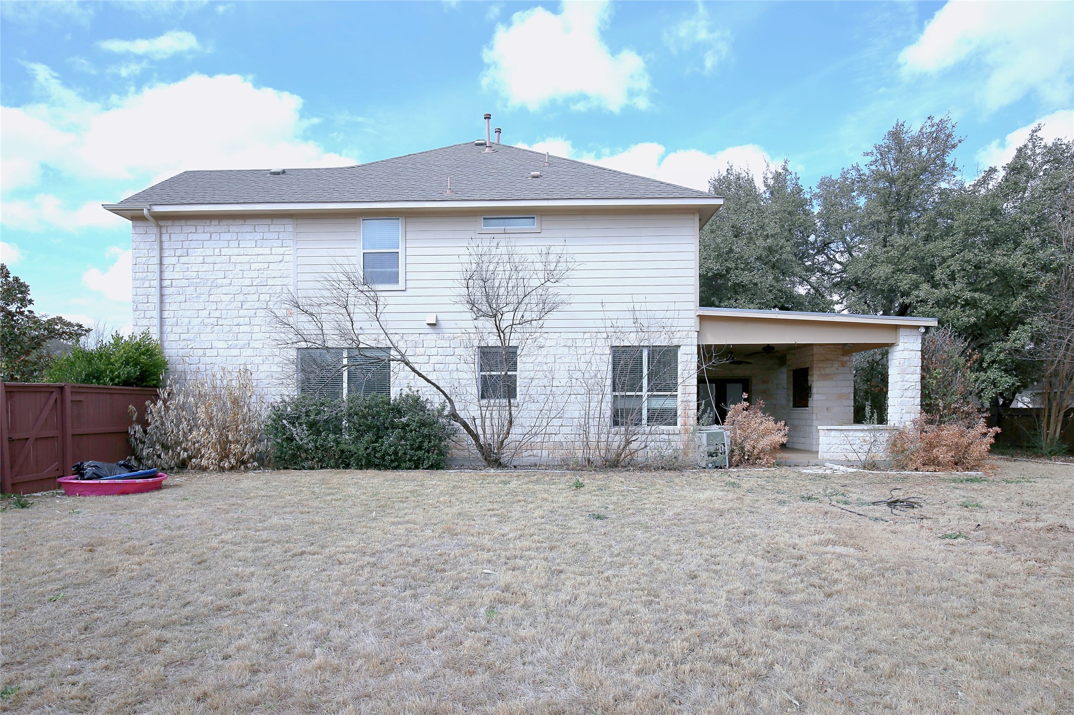 2002 Singing Hills Leander, TX 78641 - Photo 30 of 31 a front view of a house with a yard