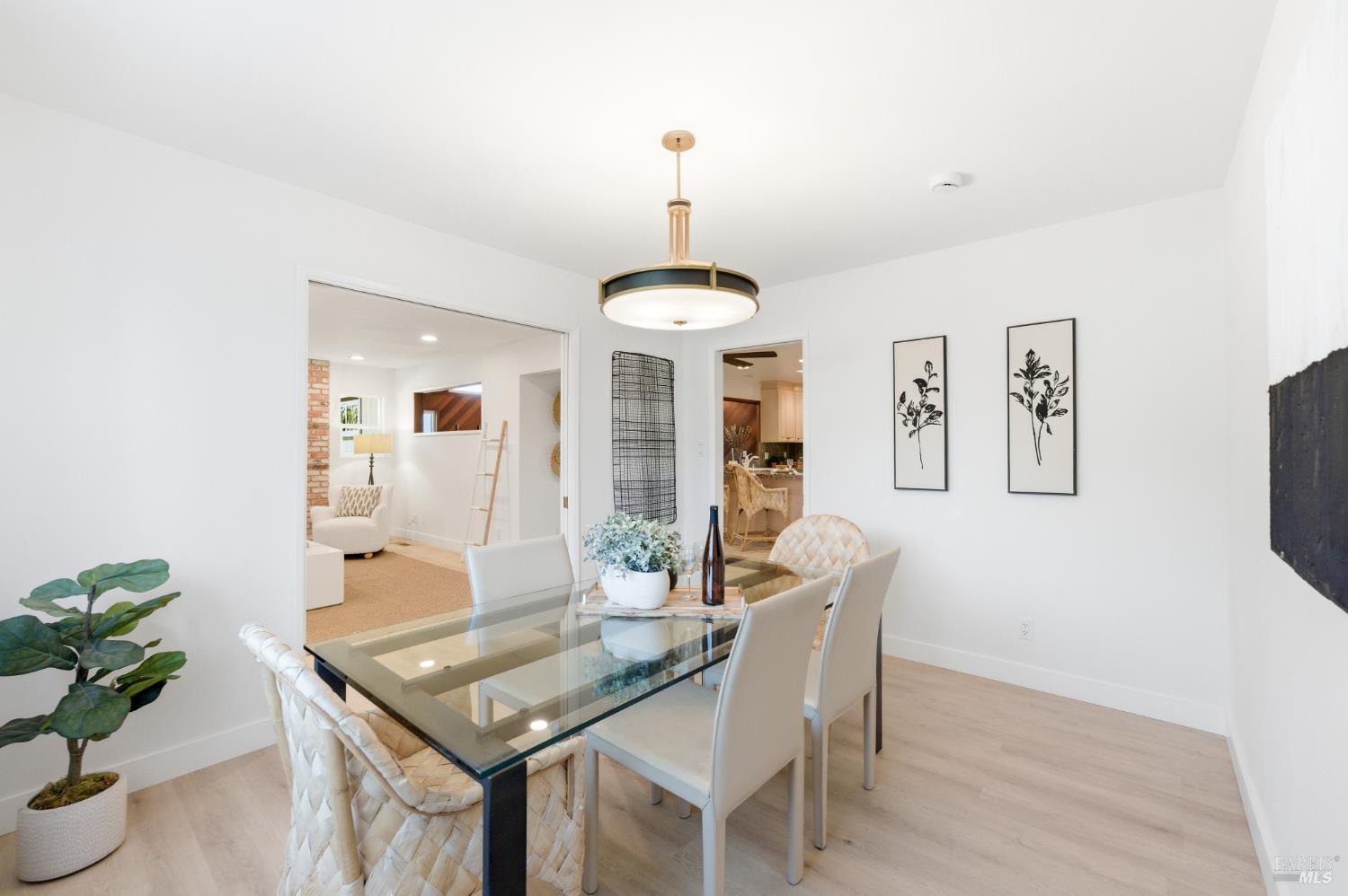 2447 Rigdon Street Napa, CA 94558 - Photo 11 of 79 a dining room with furniture potted plants and wooden floor