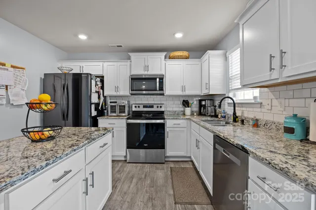 a view of a kitchen and dining room