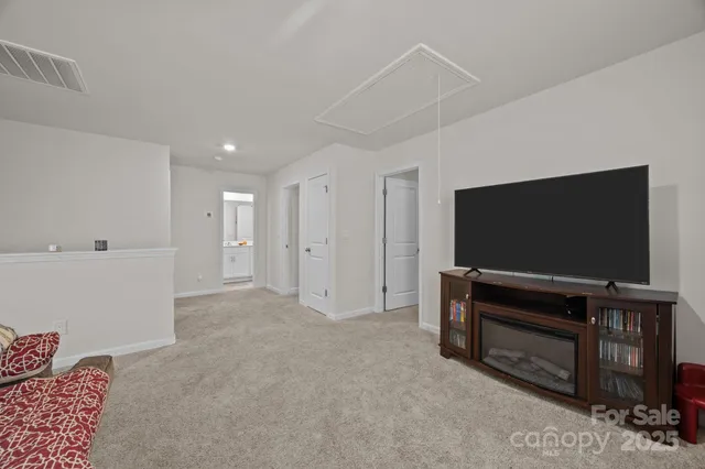 a view of a livingroom with furniture and workspace