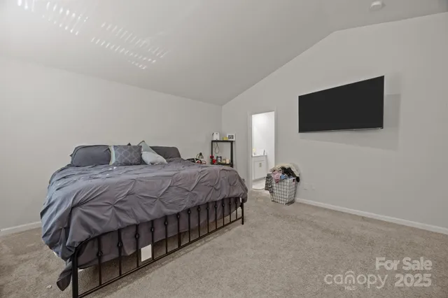 a view of walk in closet with clothes