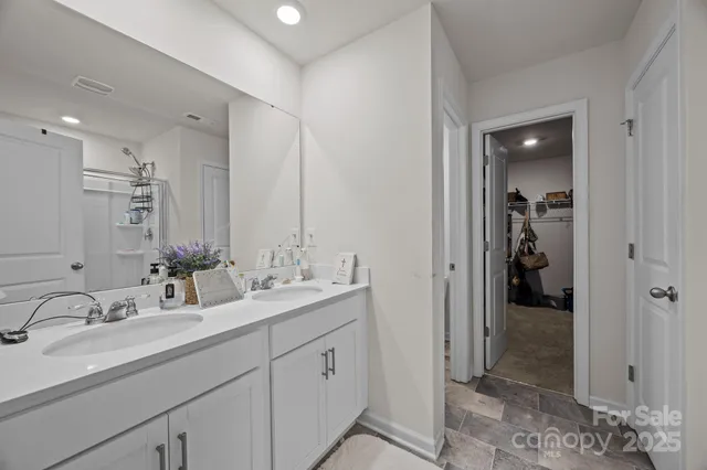 a bathroom with a tub and a shower