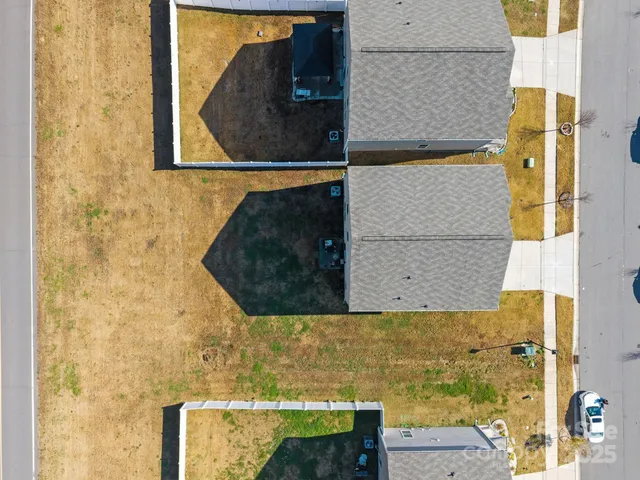 a view of a swimming pool with a yard