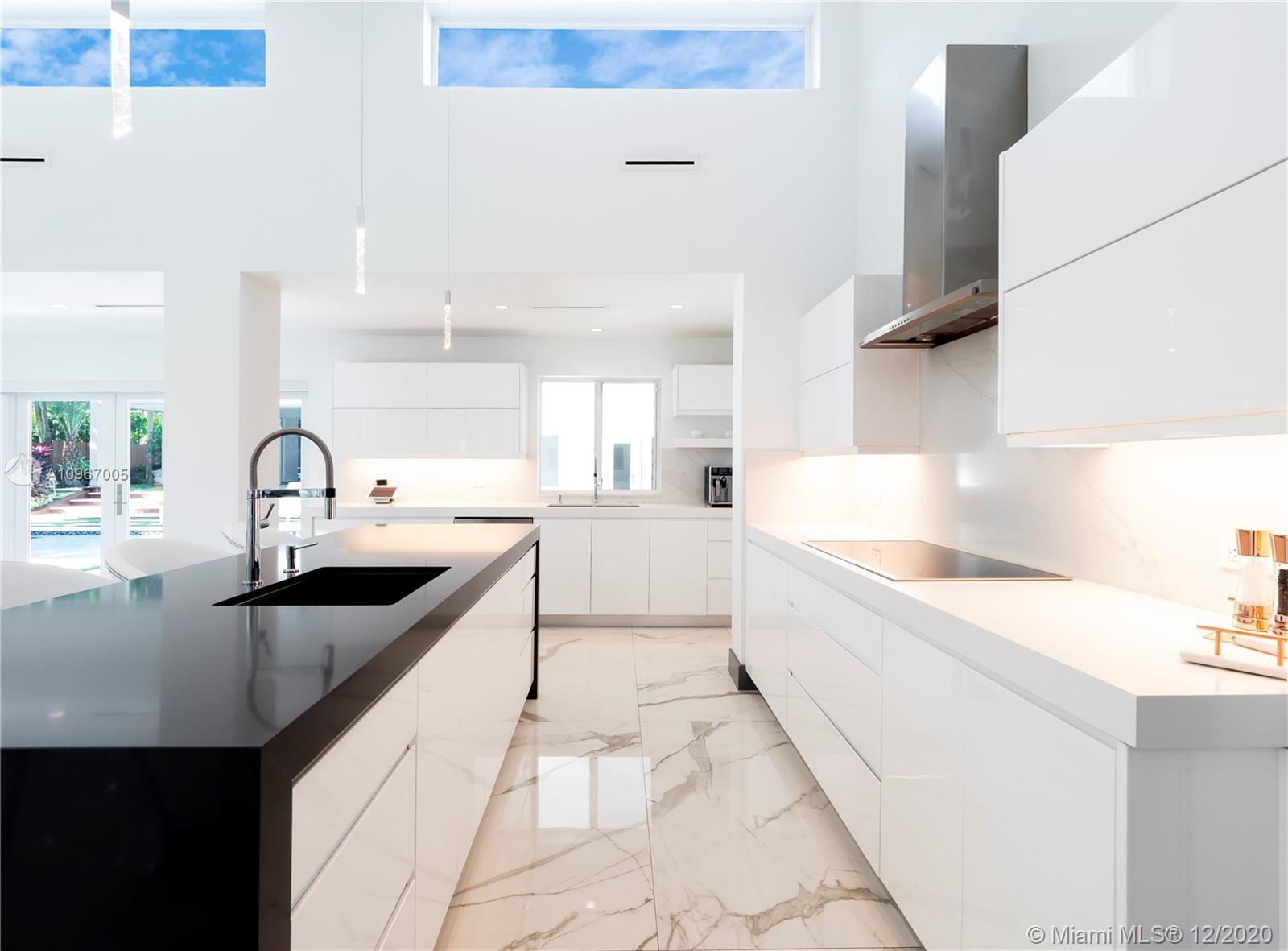 6460 Southwest 133rd Drive Pinecrest, FL 33156 - Photo 14 of 51 White and black quartz counter tops, GE Monogram SS appliances, 48-bottle wine refrigerator.