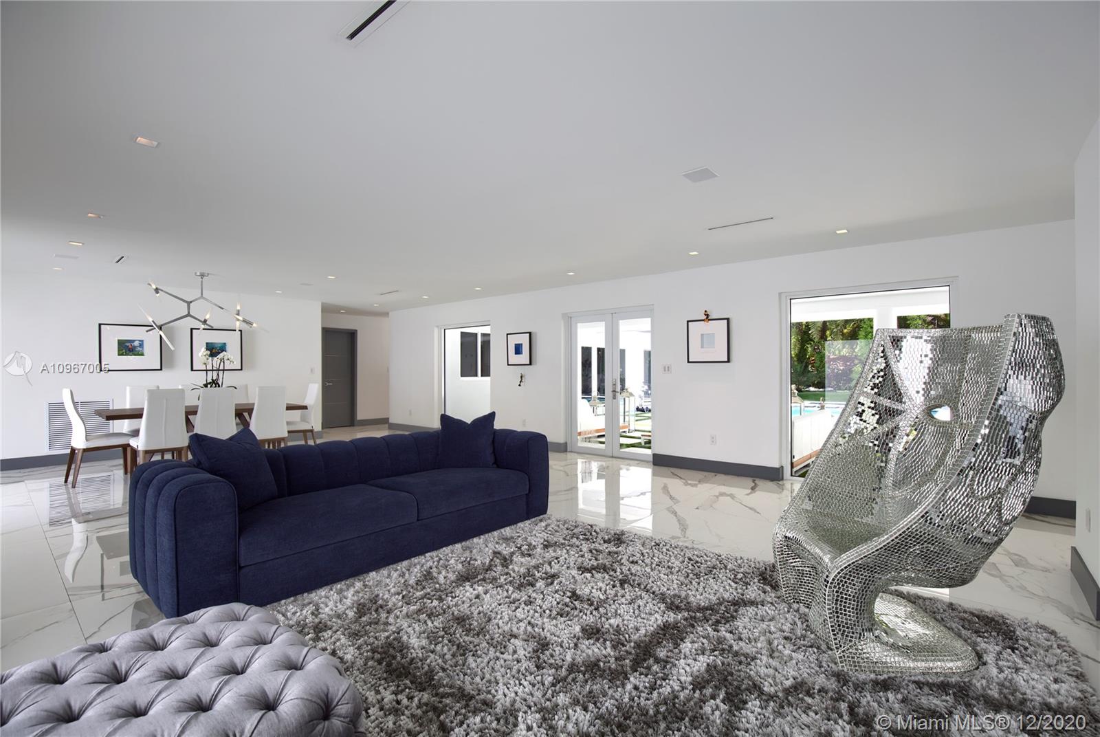 6460 Southwest 133rd Drive Pinecrest, FL 33156 - Photo 15 of 51 Formal living and dining room, with double french doors leading out to covered terrace.