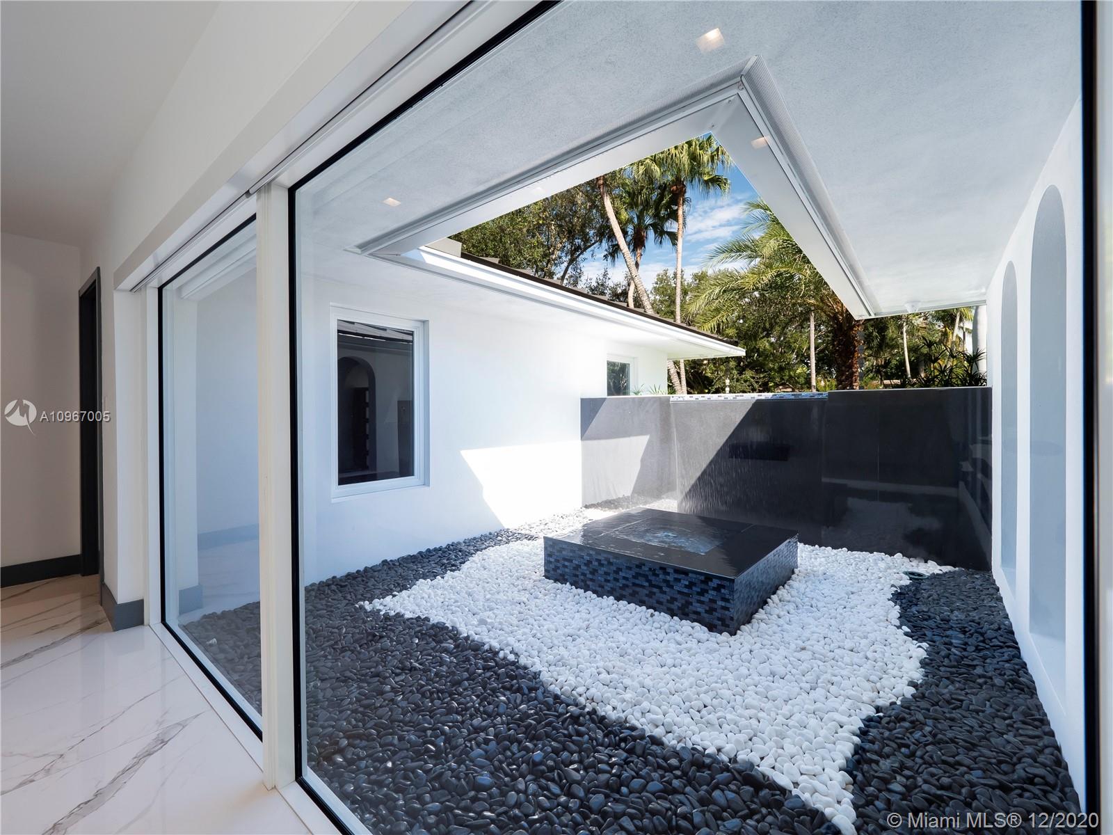 6460 Southwest 133rd Drive Pinecrest, FL 33156 - Photo 4 of 51 Water feature at interior courtyard.