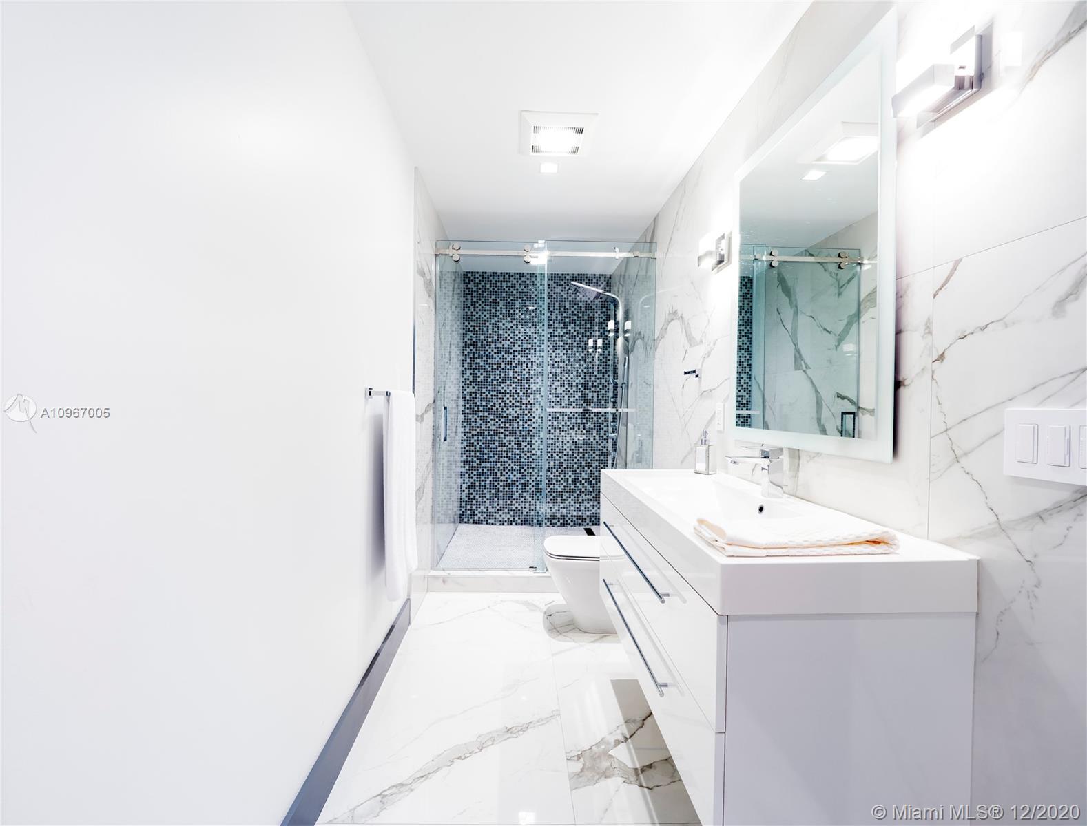 6460 Southwest 133rd Drive Pinecrest, FL 33156 - Photo 32 of 51 Full bath shared by media room and bedroom #1.