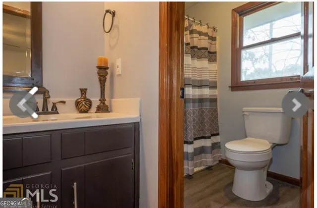 a bathroom with a sink and toilet