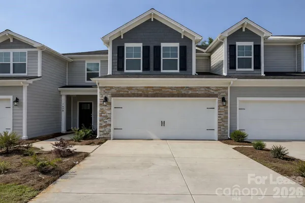a front view of a house with yard