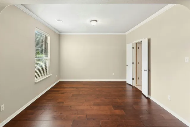 a kitchen with kitchen island granite countertop a sink stove and cabinets