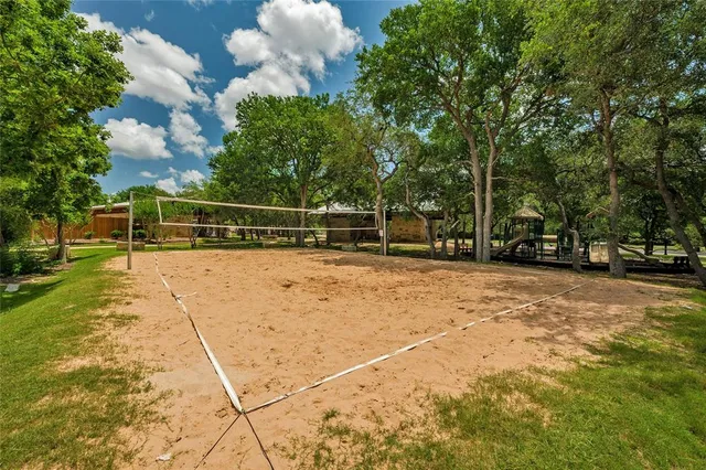 a view of a playground with basketball court