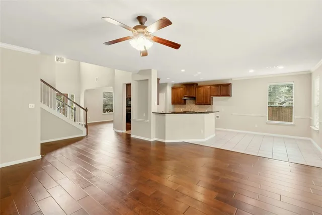 a kitchen with stainless steel appliances a refrigerator sink and microwave
