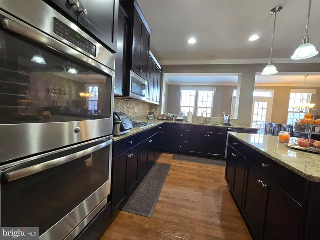 a kitchen with a counter space cabinets and appliances