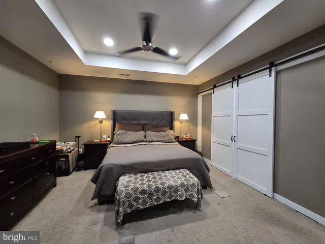 a view of a livingroom with furniture and a flat screen tv