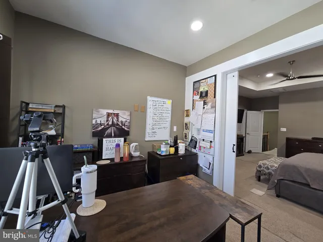a work room with furniture and a window