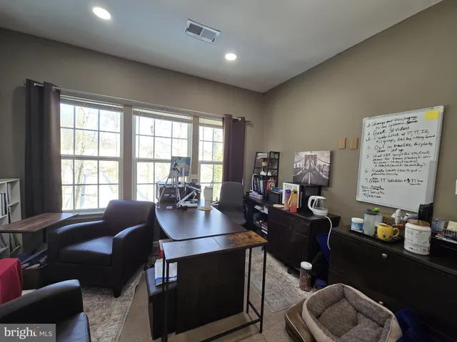 a bathroom with a tub and a window