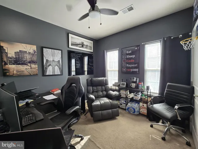 a bathroom with a toilet a sink a vanity and mirror
