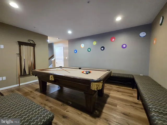 a room with furniture and pool table