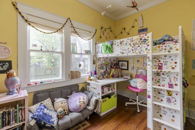 a bedroom with furniture and a window
