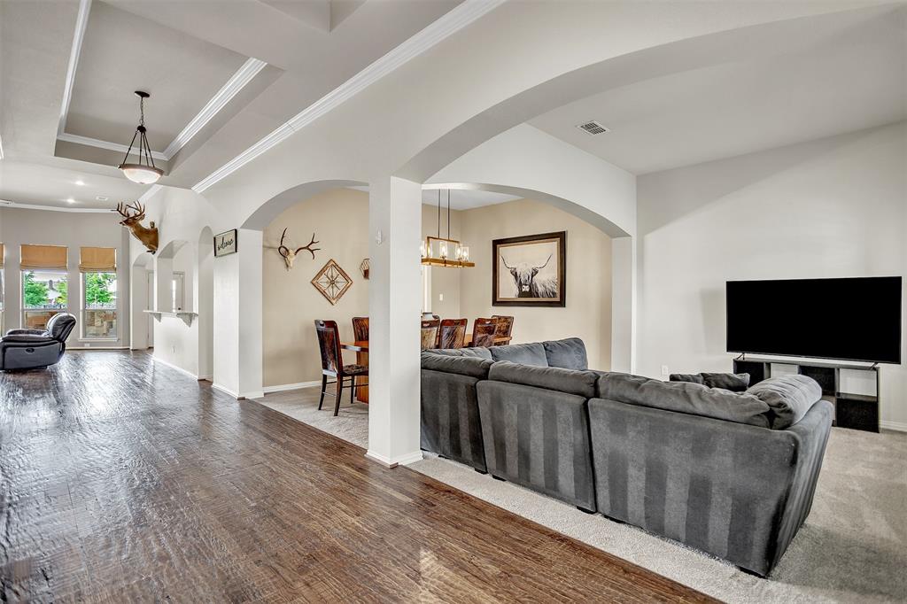 12286 Emerald Ranch Lane North Forney, TX 75126 - Photo 6 of 40 a living room with furniture and a flat screen tv