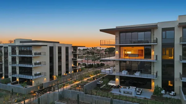 a front view of a building with glass windows and door