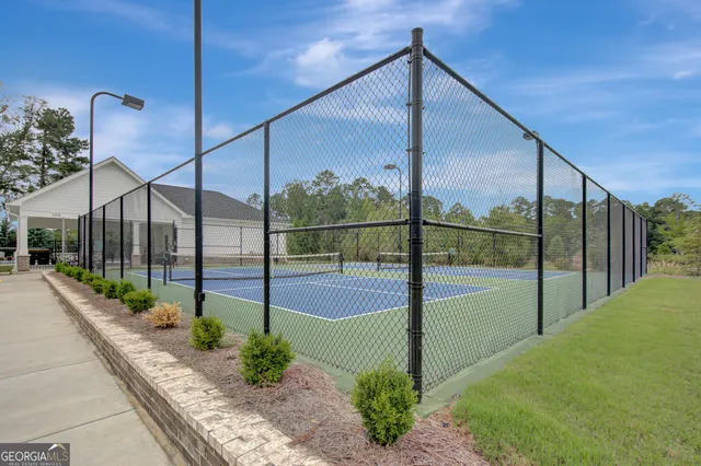 a street sign on a brick wall