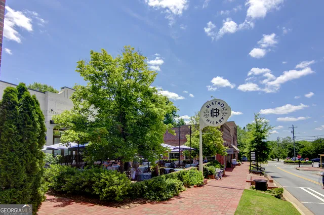 a view of a table and chairs under an umbrella
