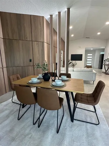 a view of a dining room with furniture