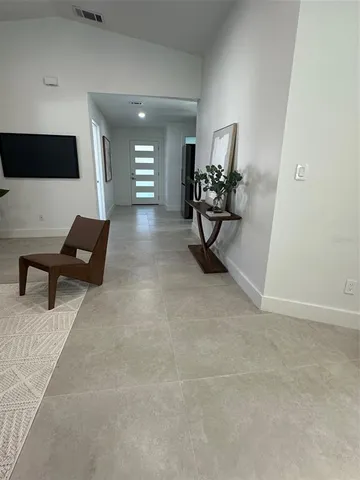 a living room with furniture and a rug
