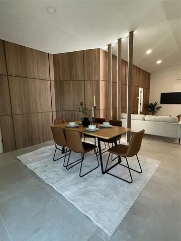 a view of a dining room with furniture