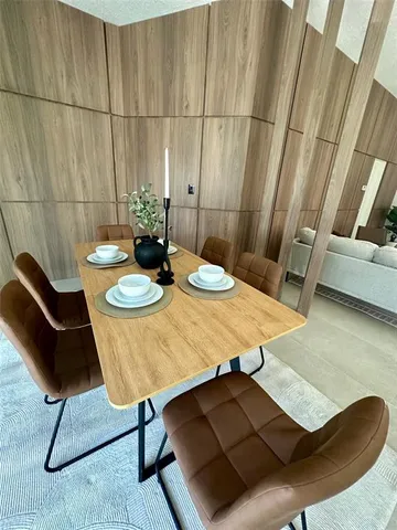 a view of a livingroom with furniture and window