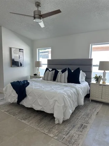 a living room with furniture and a dining table