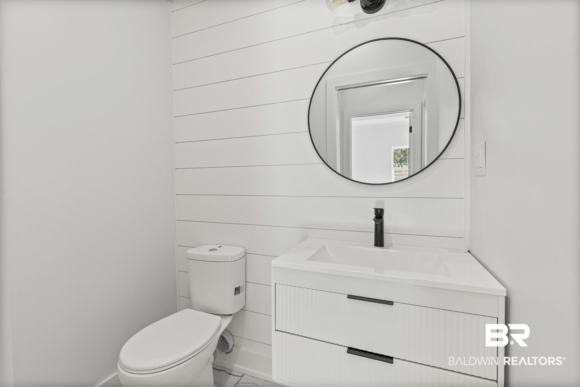10180 Pineview Drive Foley, AL 36535 - Photo 29 of 47 Bathroom with vanity and wood walls