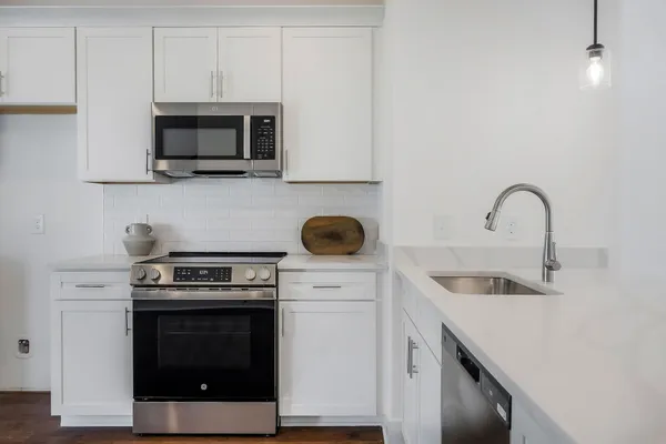 a kitchen with a stove and a microwave
