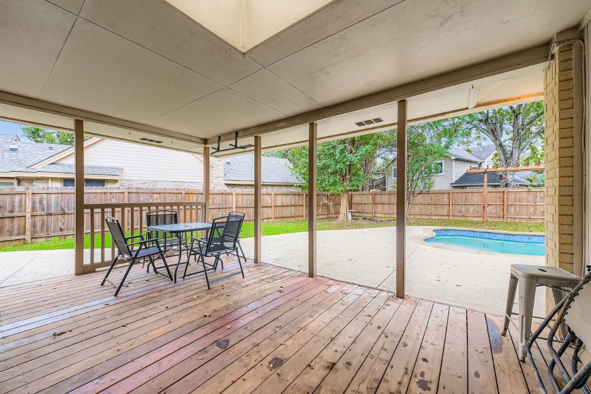 10705 Pinehurst Drive Austin, TX 78747 - Photo 23 of 30 Relax on the covered patio with room to grill and dine.