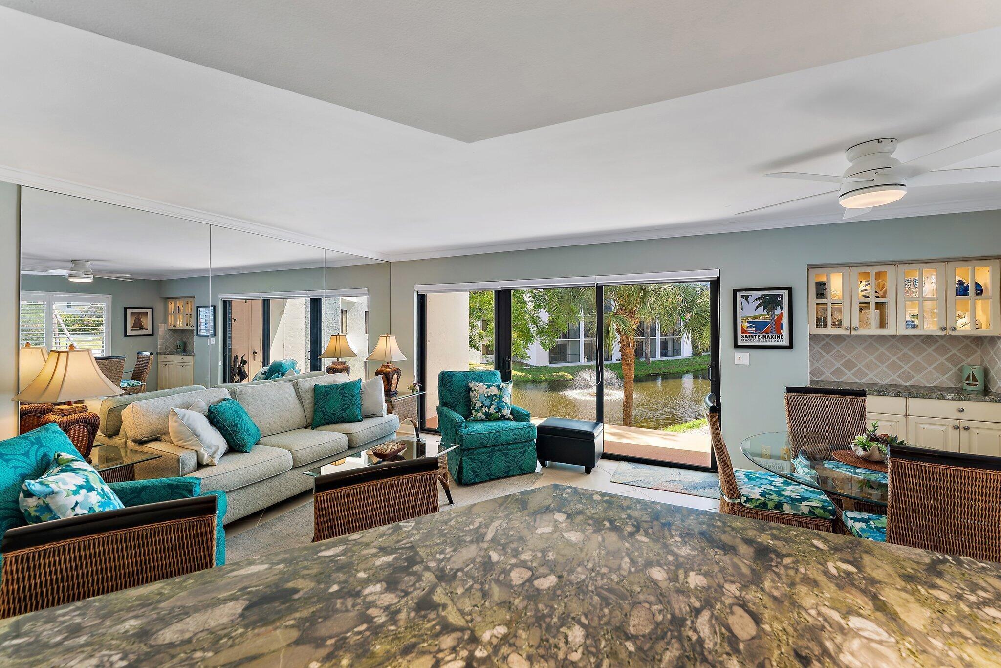 1605 Us-1, Unit B206 Jupiter, FL 33477 - Photo 16 of 35 a living room with furniture and a large window
