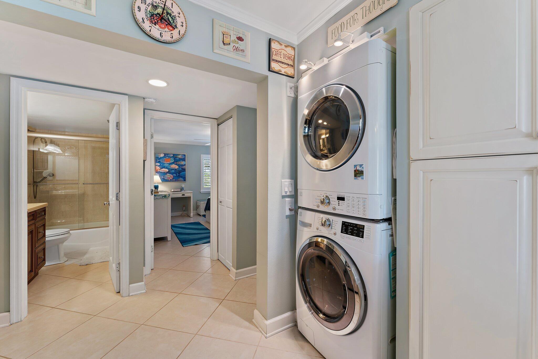 1605 Us-1, Unit B206 Jupiter, FL 33477 - Photo 19 of 35 a view of a hallway with washer and dryer