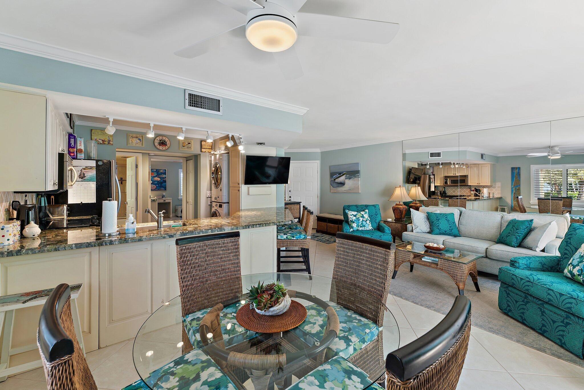 1605 Us-1, Unit B206 Jupiter, FL 33477 - Photo 2 of 35 a living room with furniture kitchen view and a large window