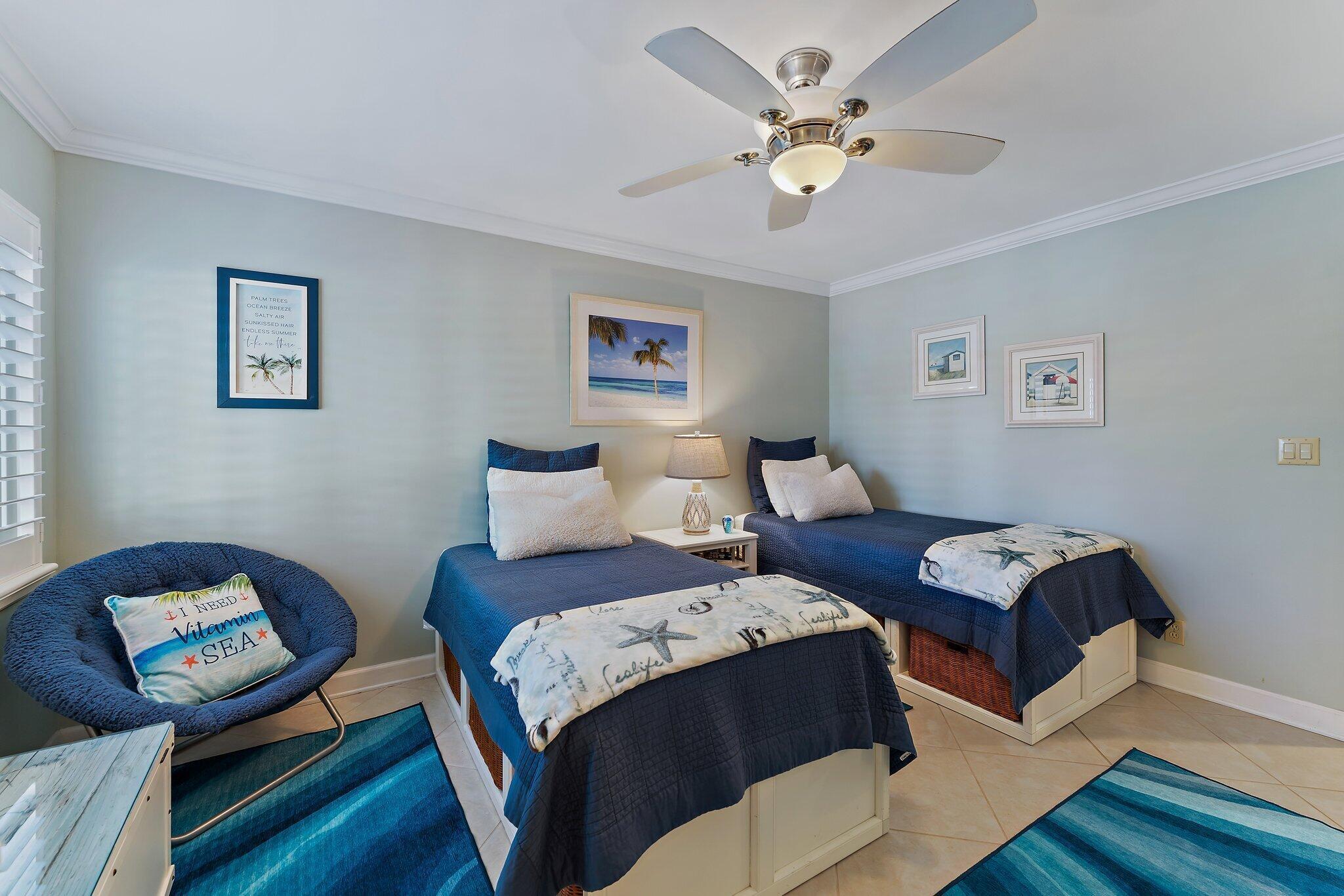 1605 Us-1, Unit B206 Jupiter, FL 33477 - Photo 22 of 35 a bedroom with a bed and wooden floor