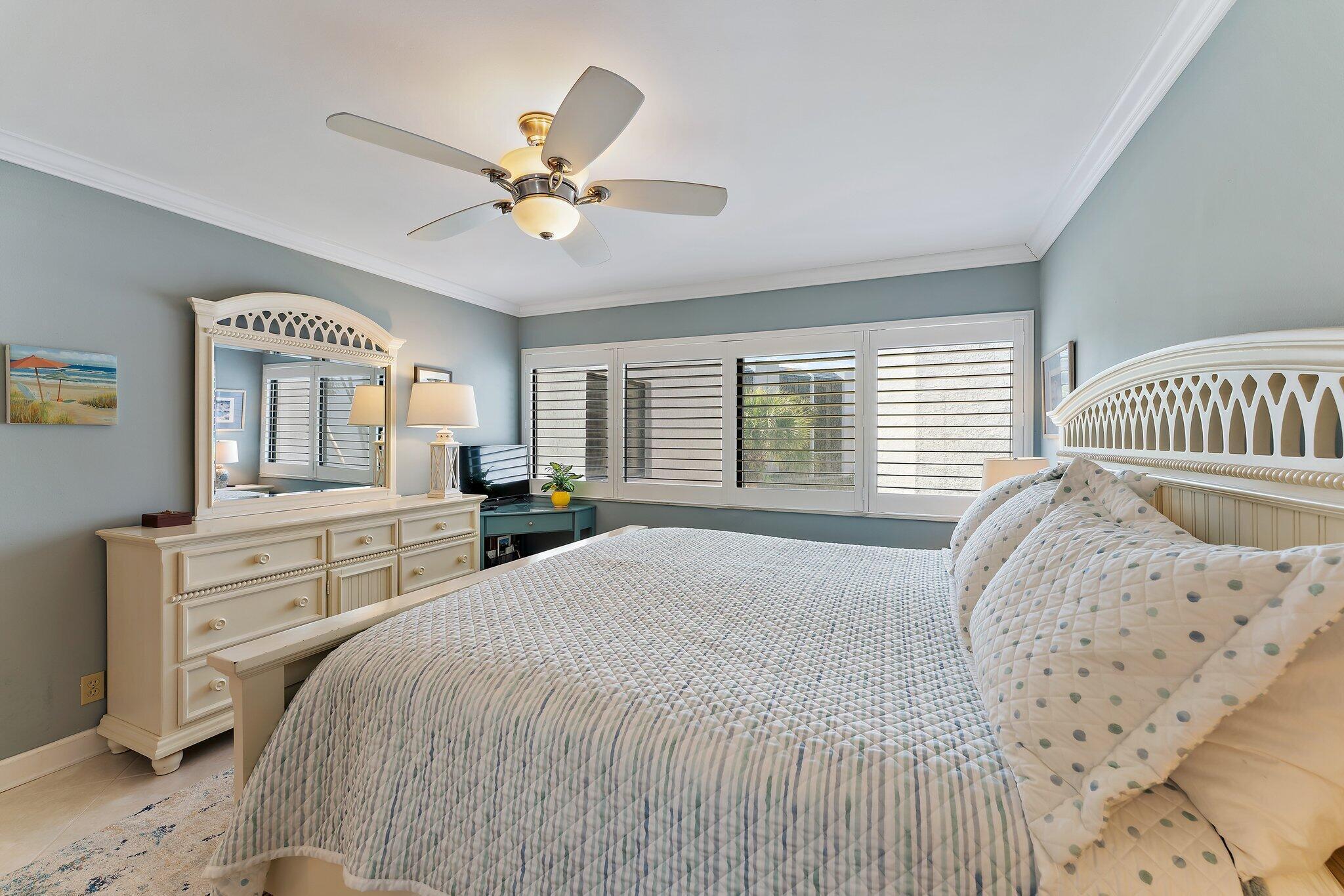1605 Us-1, Unit B206 Jupiter, FL 33477 - Photo 25 of 35 a bedroom with a large bed and a window