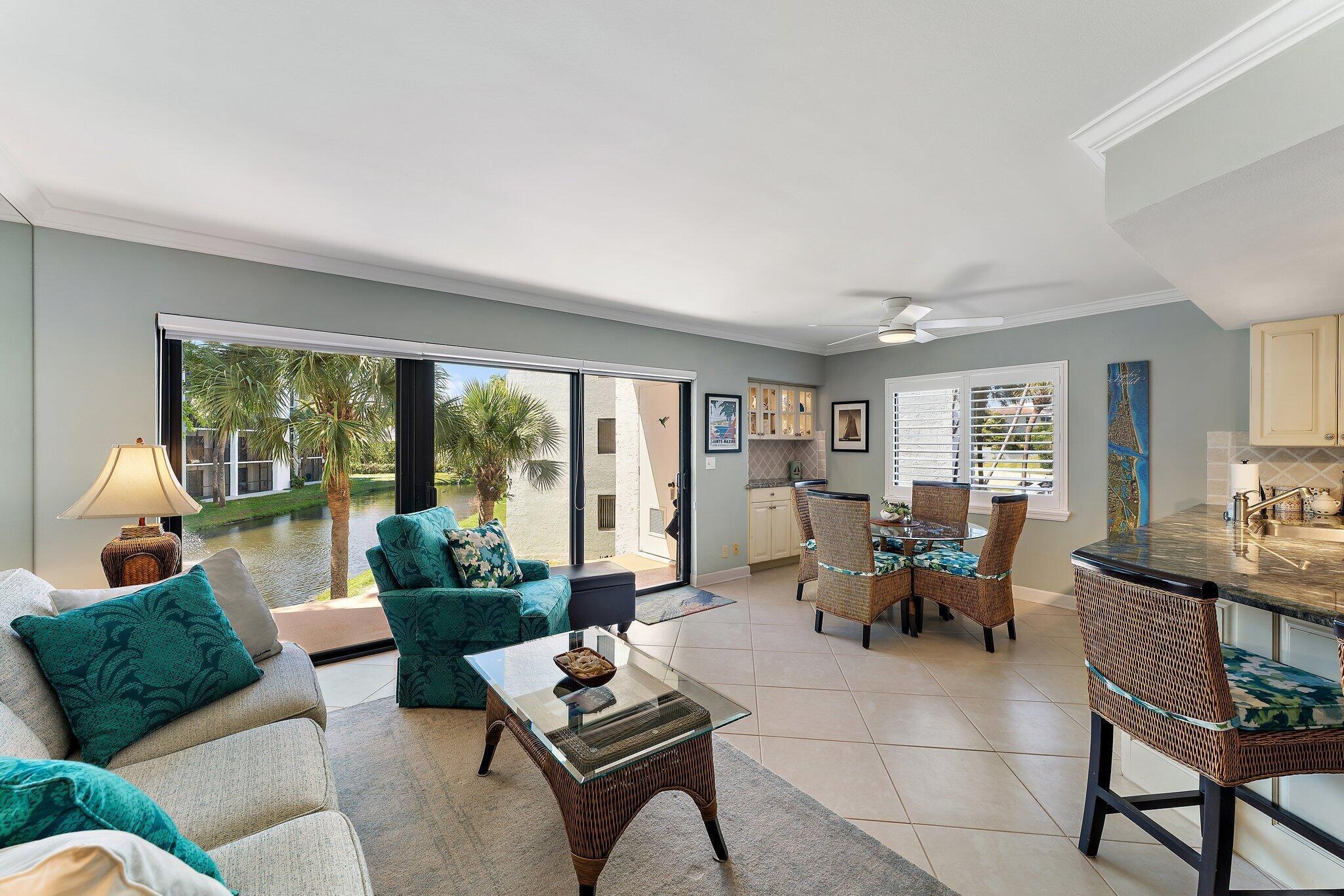 1605 Us-1, Unit B206 Jupiter, FL 33477 - Photo 3 of 35 a living room with furniture and a table