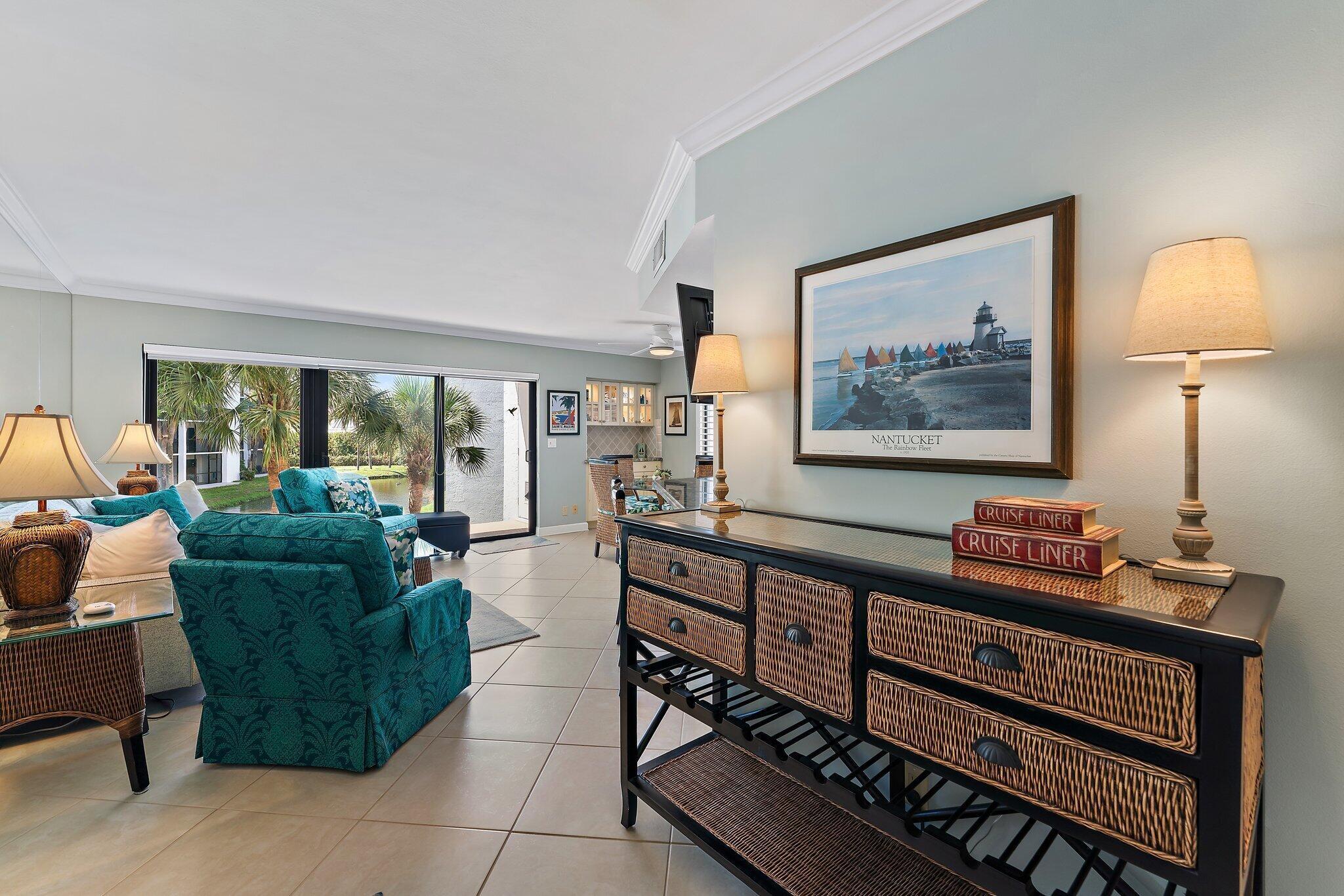1605 Us-1, Unit B206 Jupiter, FL 33477 - Photo 6 of 35 a living room with furniture and a window