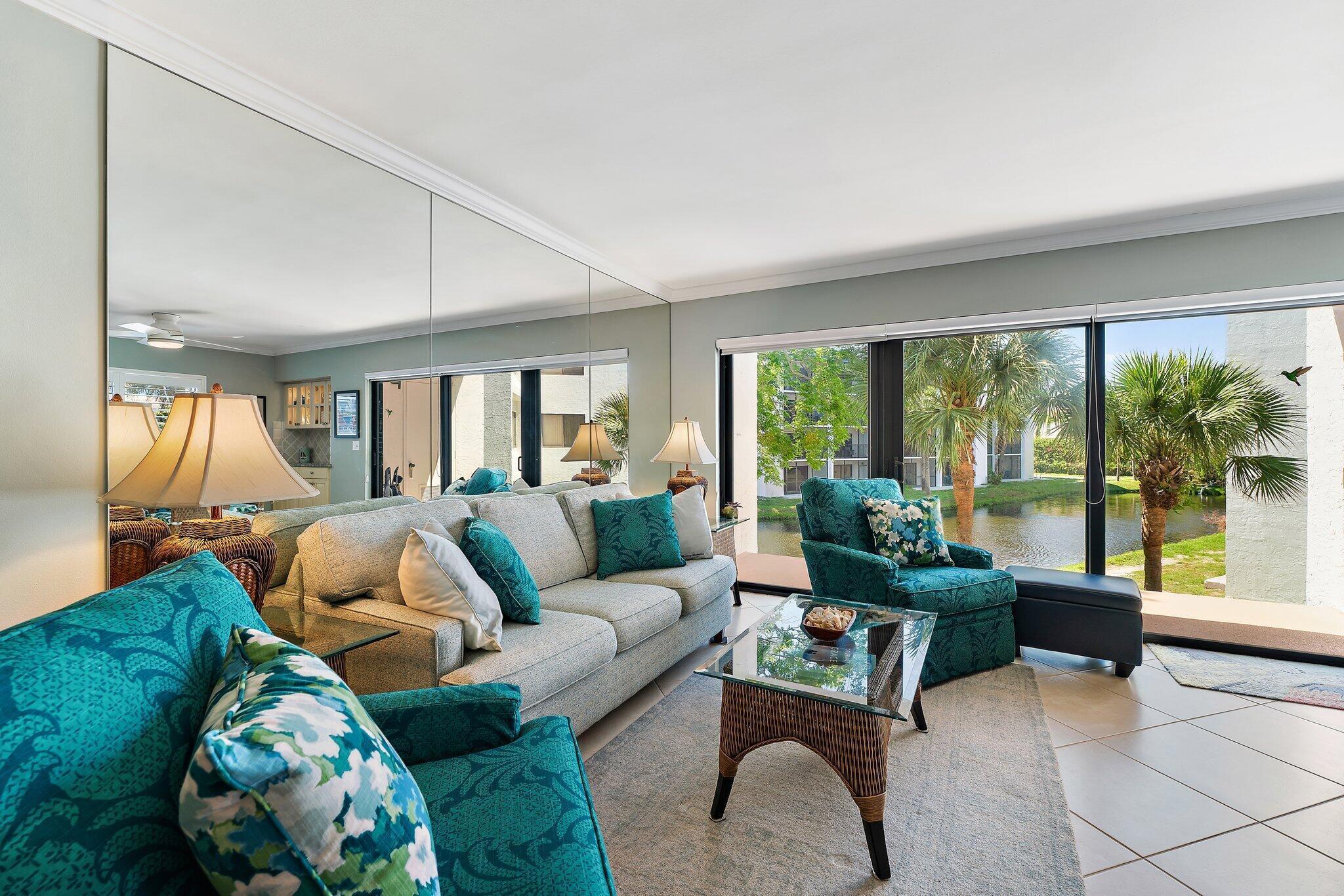 1605 Us-1, Unit B206 Jupiter, FL 33477 - Photo 7 of 35 a living room with furniture and a large window